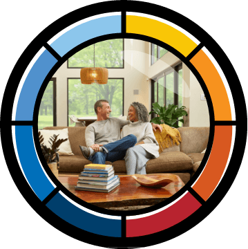 older couple sitting on couch in their living room