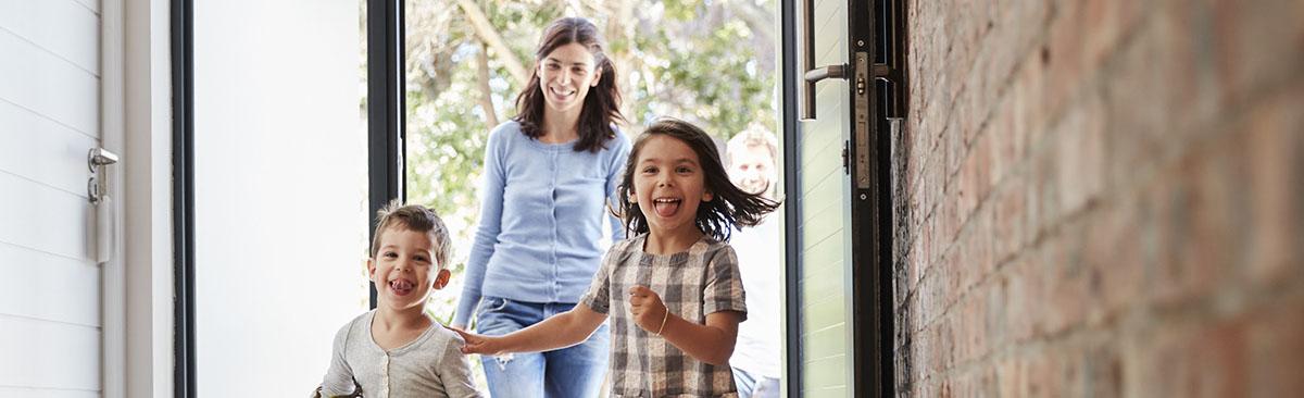 family running in front door